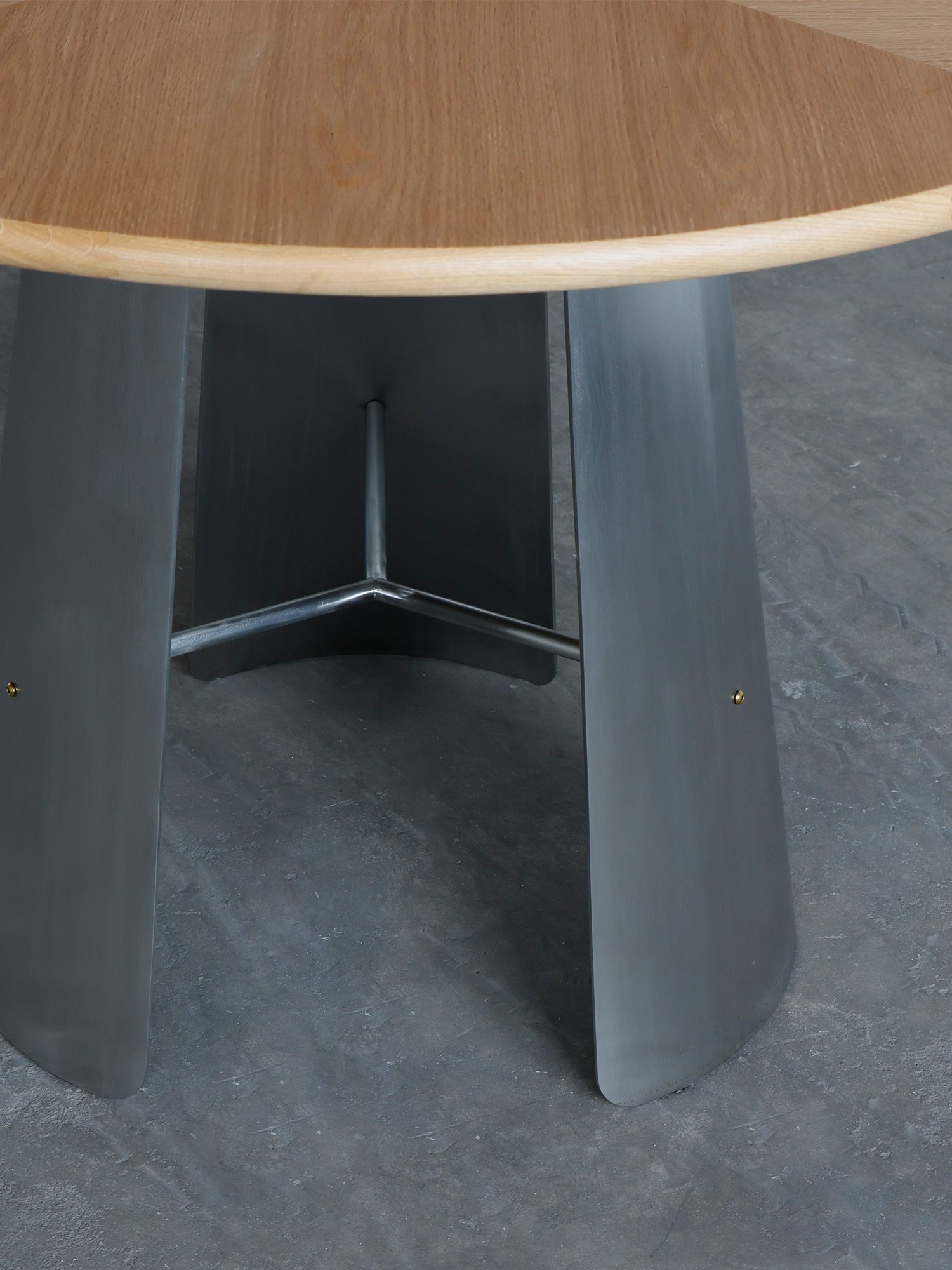 Monet Round Table-wood top 16 Monet steel pedestal leg junction close-up