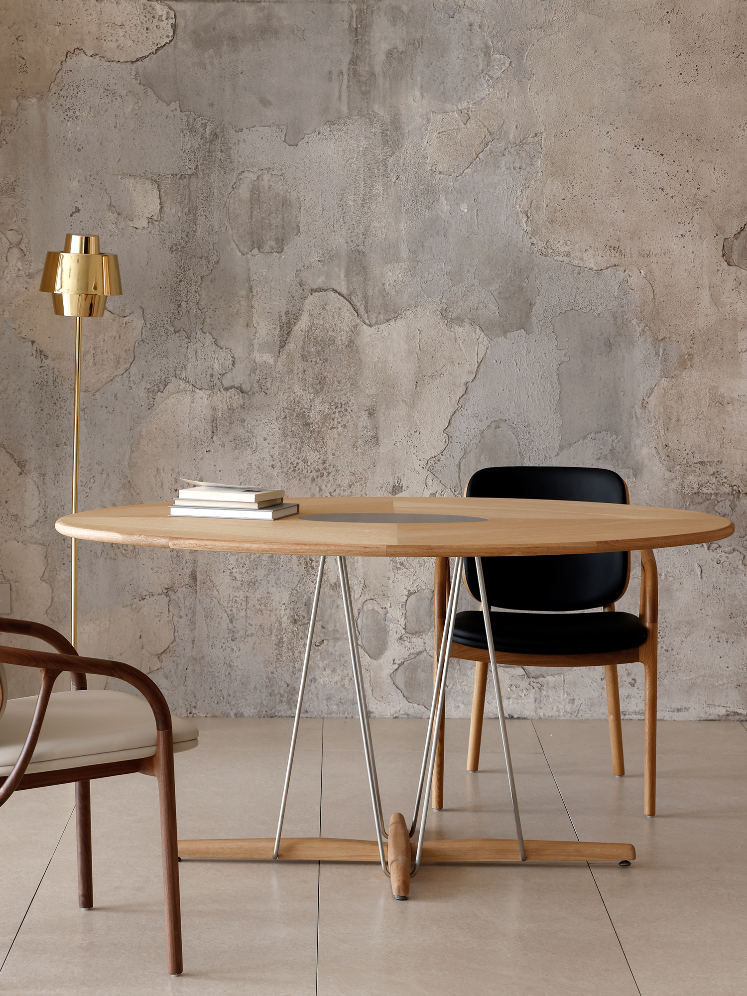 Pebble dining table 21 Pebble oak veneer table in room with dining chairs
