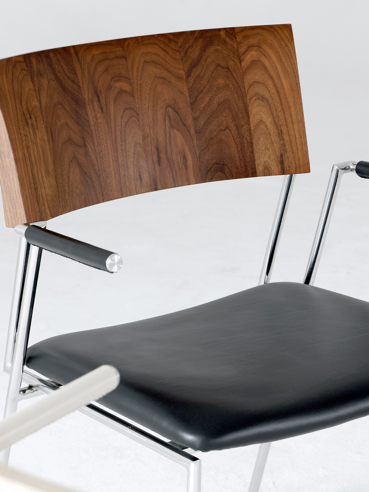 Shuge chair 16 Shuge black walnut back and black leather seat close-up