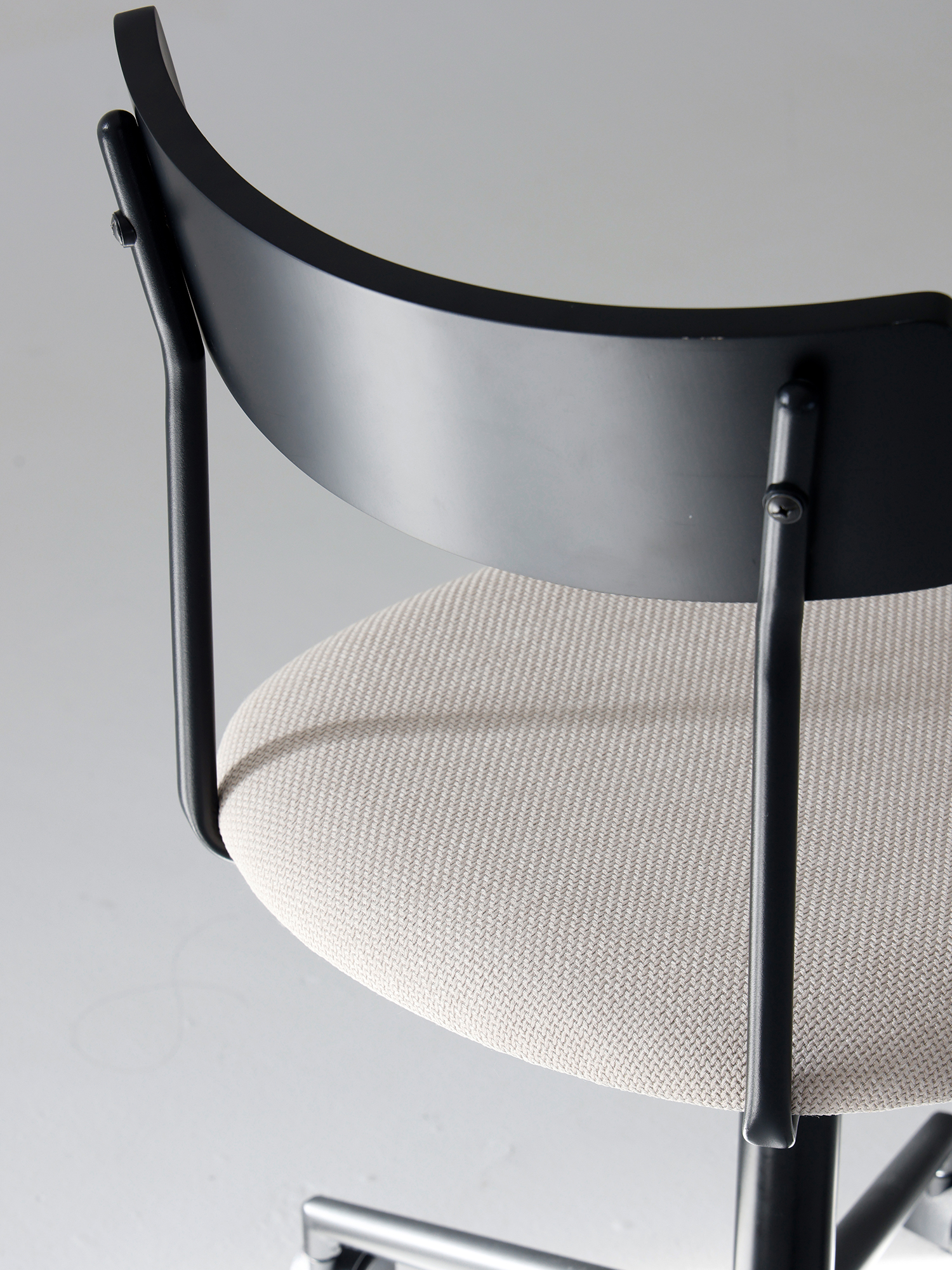 Lift chair 17 Lift Chair curved black backrest and off-white cushion detail