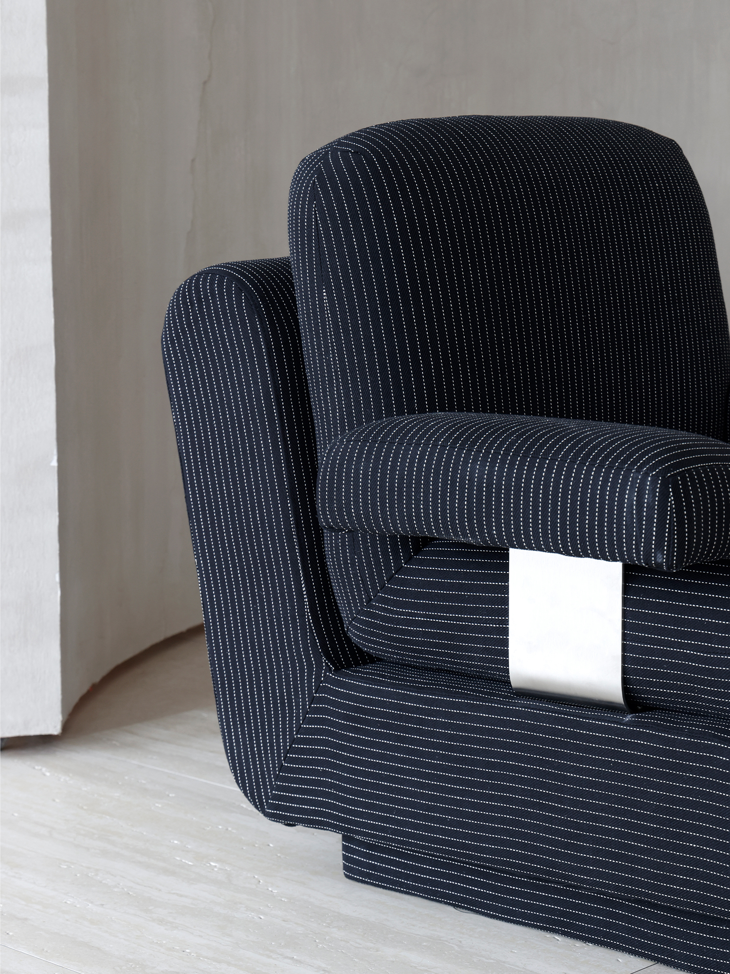 Rest sofa 16 Deeprest dark striped sofa armrest and stainless-steel support detail