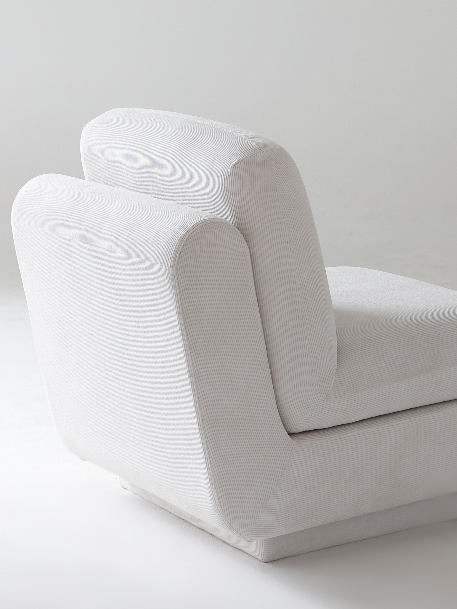 Rest sofa 17 Deeprest off-white armless sofa rear three-quarter view