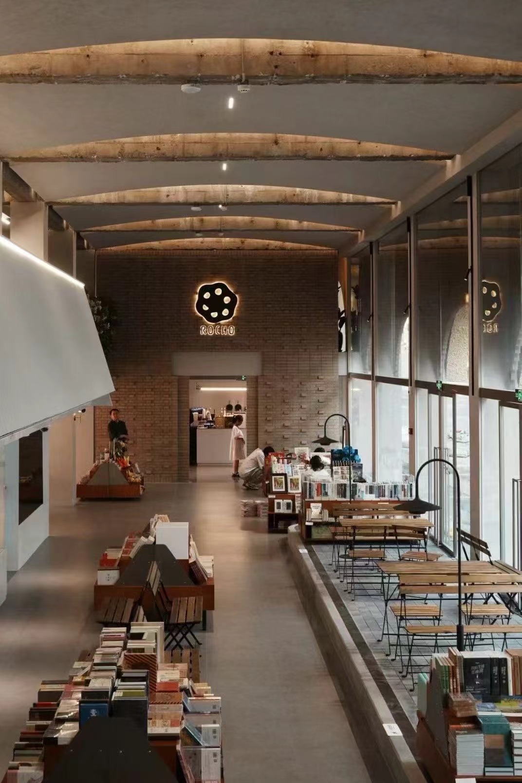 Jinchuang Bookstore interior with long tables and bench seating