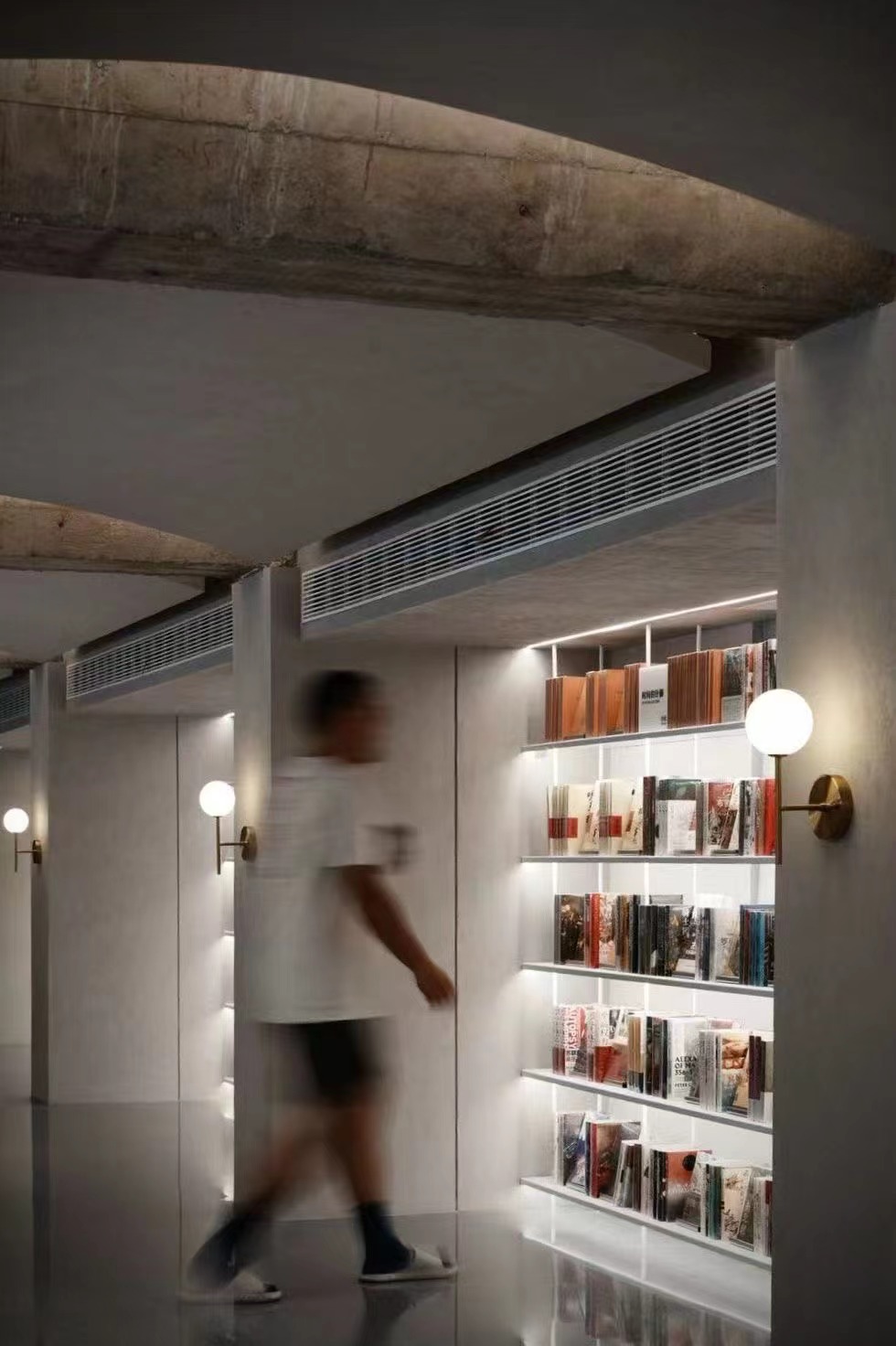 Illuminated shelving area inside Jinchuang Bookstore