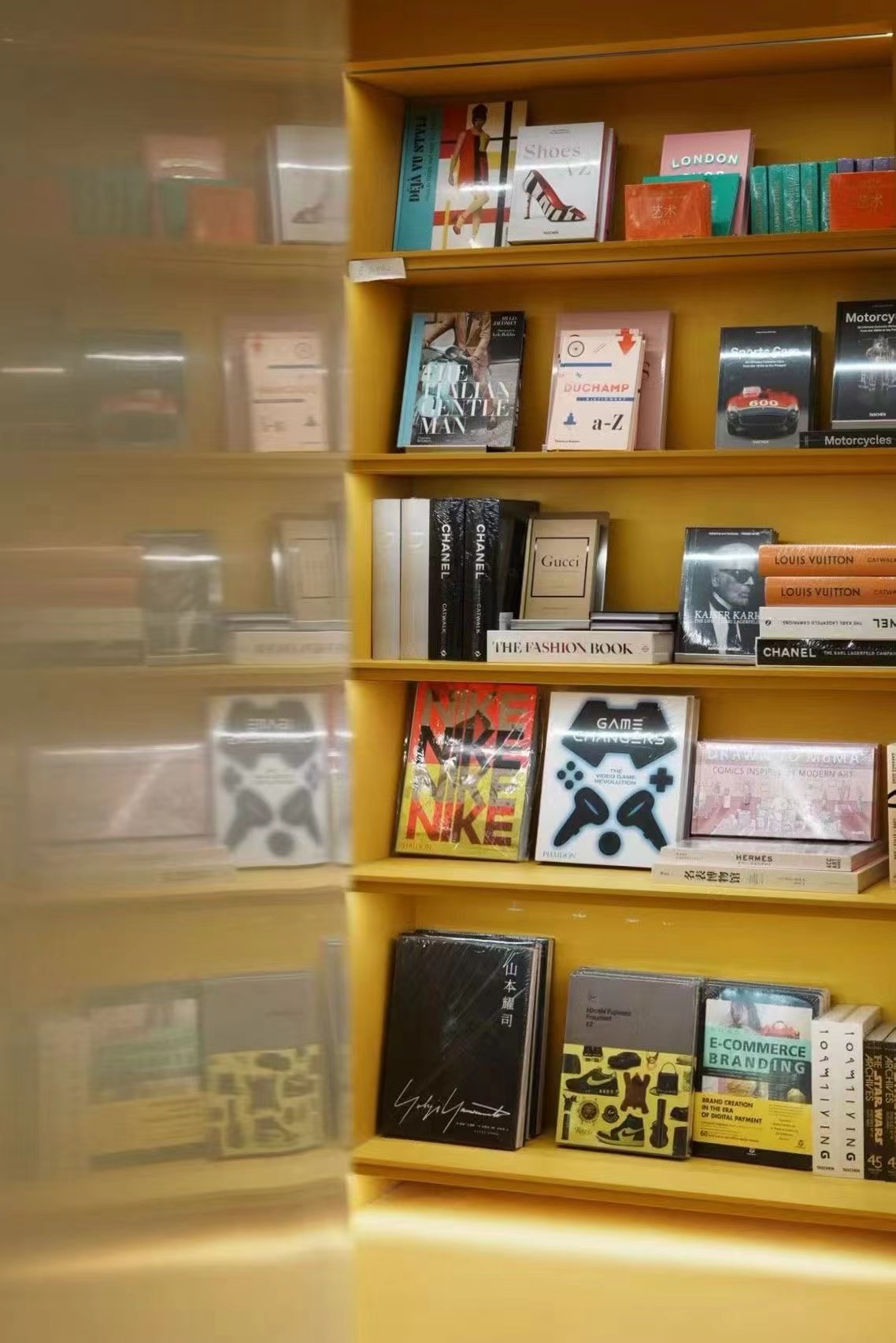 Warm yellow bookshelves inside Jinchuang Bookstore