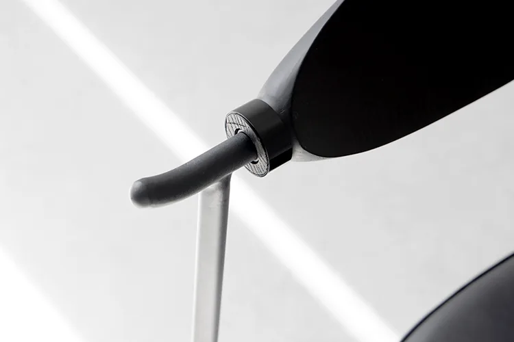 Alison Chair 2.0 Design Story 20 Close view of the stainless steel and wood backrest connection