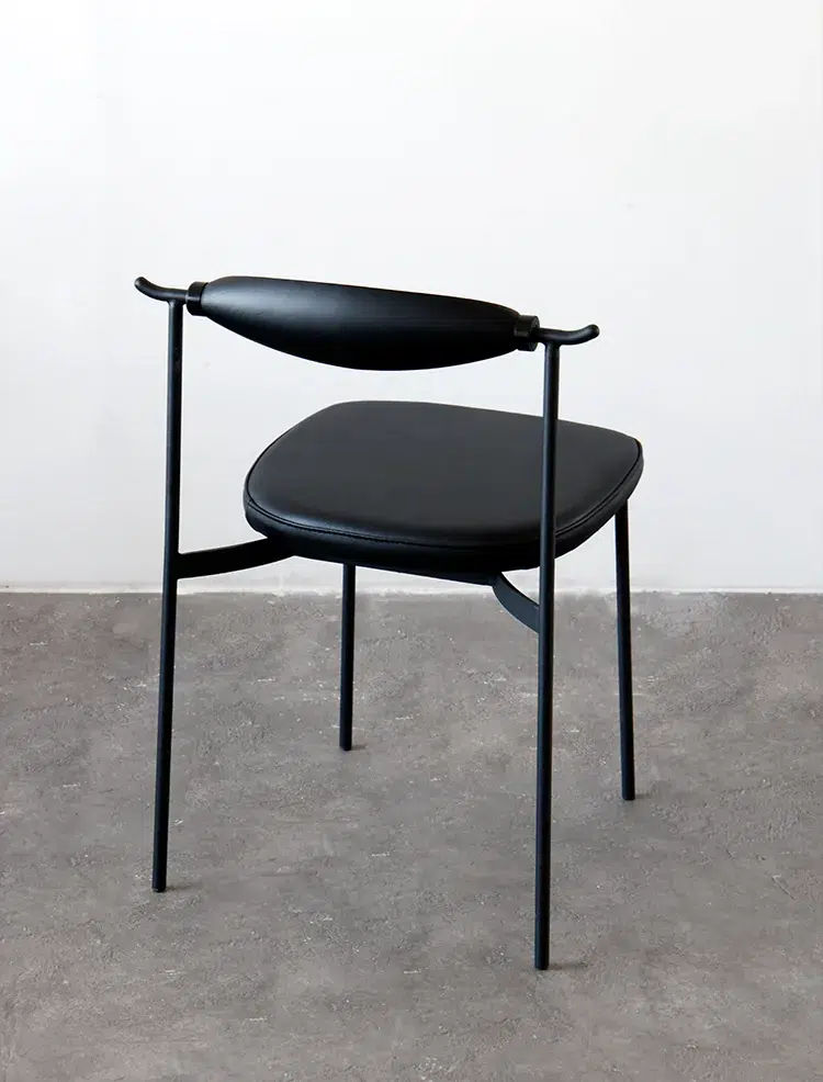 Alison Chair 2.0 Design Story 19 Black Alison Chair 2.0 against a neutral wall