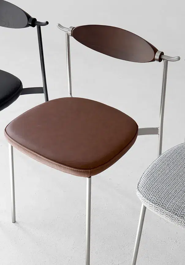 Alison Chair 2.0 Design Story 16 Alison Chair 2.0 showing wood backrests and upholstered seats
