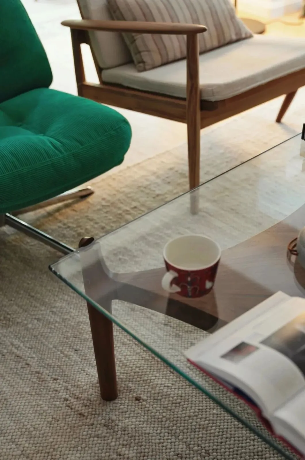 Coffee Table Size for Living Rooms 16 Glass coffee table beside a green lounge chair