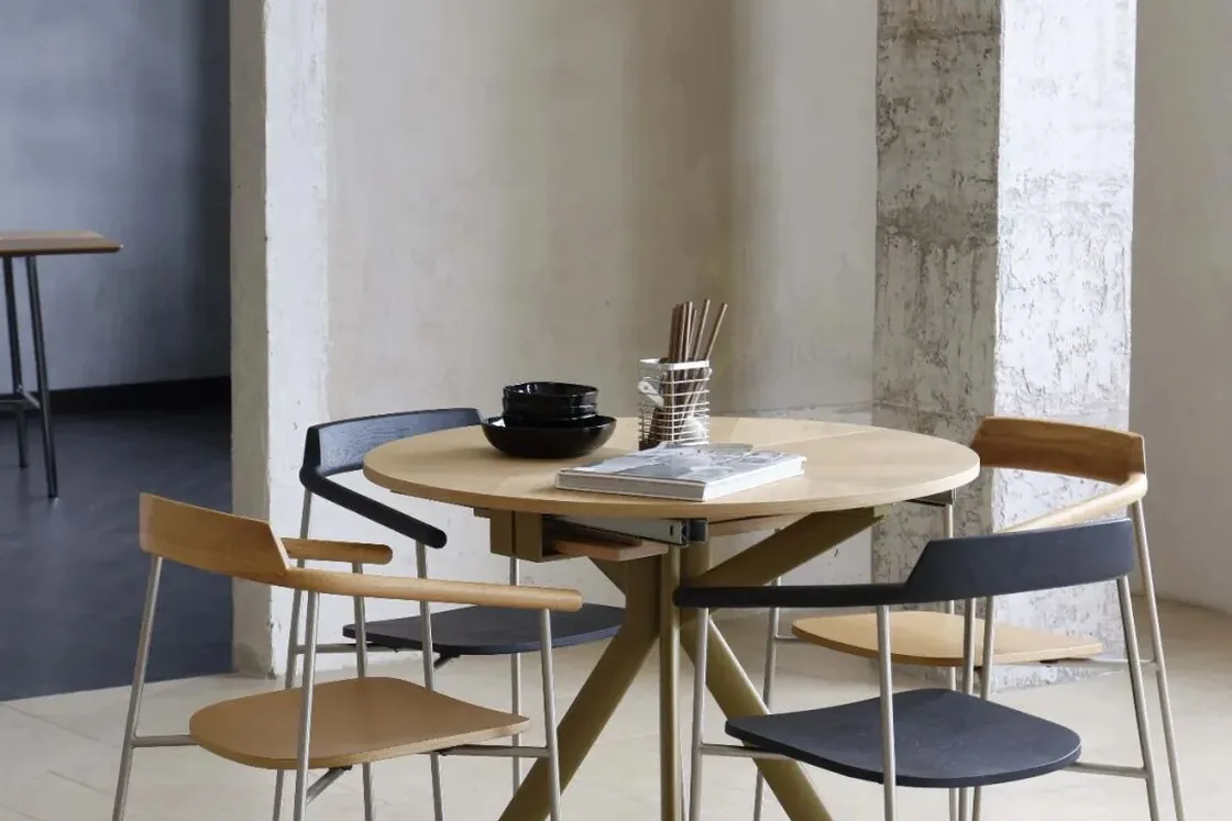 Mixed dining chairs arranged around a round table