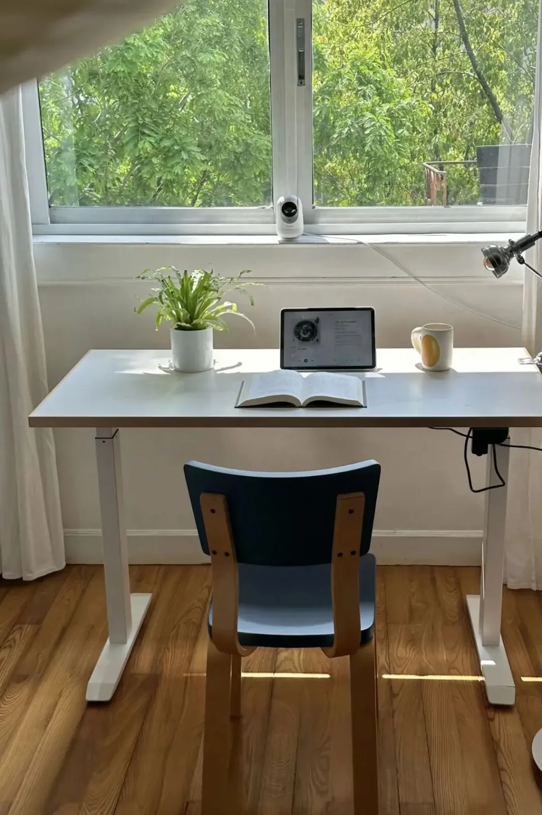 Furniture by the Window 18 Compact desk and chair centred below a wide window