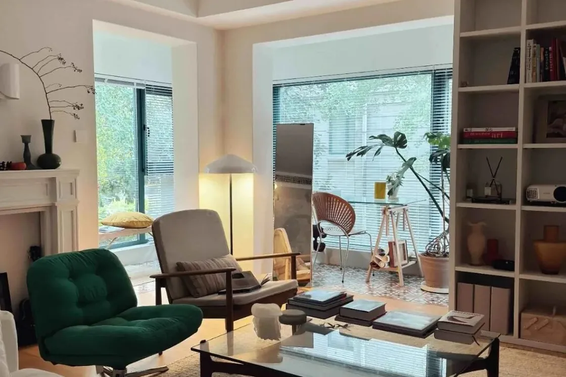 Living room arranged around a wide window and natural light