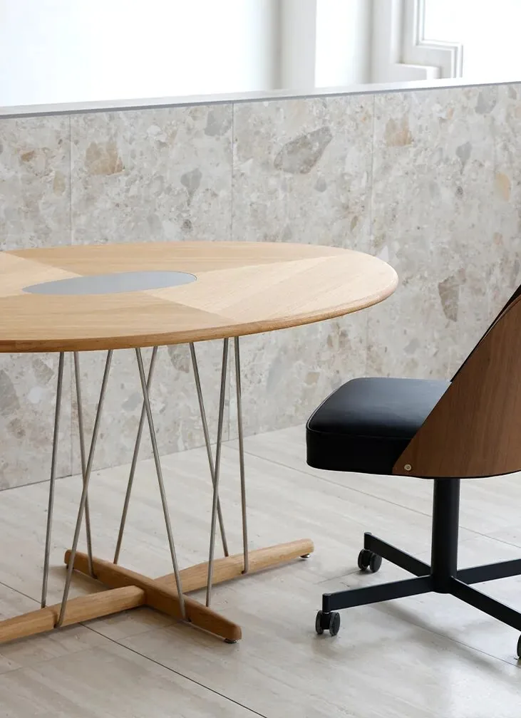 Restaurant Table Sizes and Seating Capacity Guide 20 Oval Pebble dining table beside a stone wall