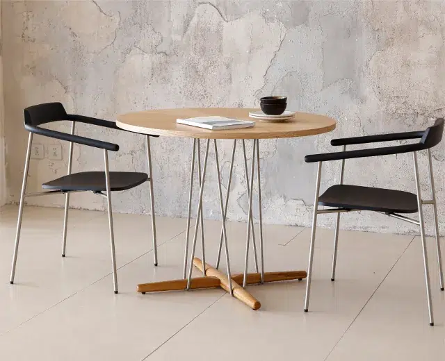 Restaurant Table Sizes and Seating Capacity Guide 14 Round wood dining table set with two armchairs