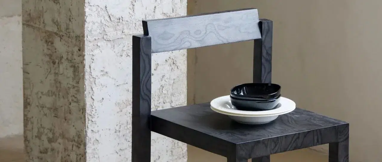 Solid Wood vs Wood Veneer for Furniture Projects 17 Burl veneer Klein Chair with a ceramic cup