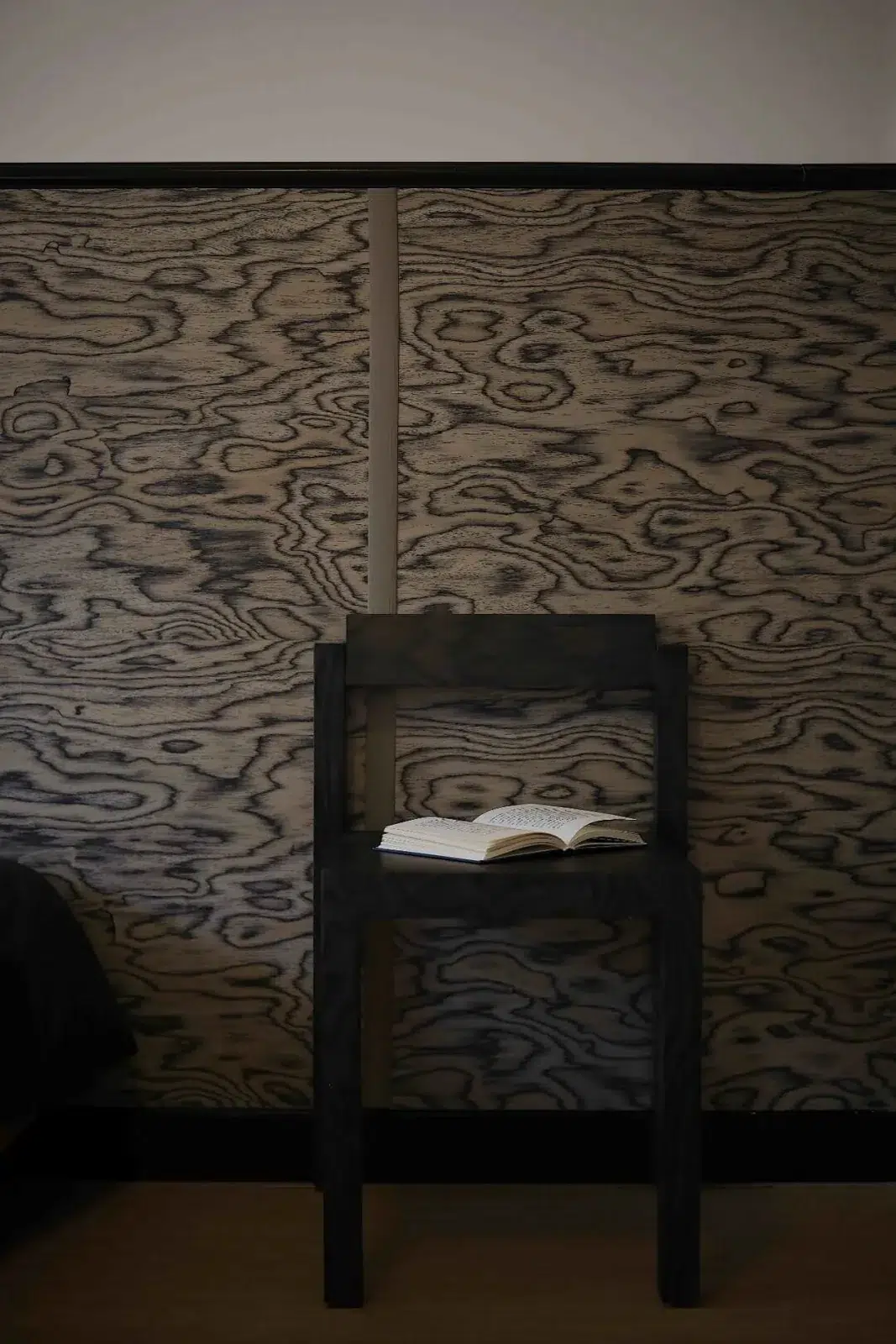 Solid Wood vs Wood Veneer for Furniture Projects 19 Dark veneer Klein Chair against a patterned wall